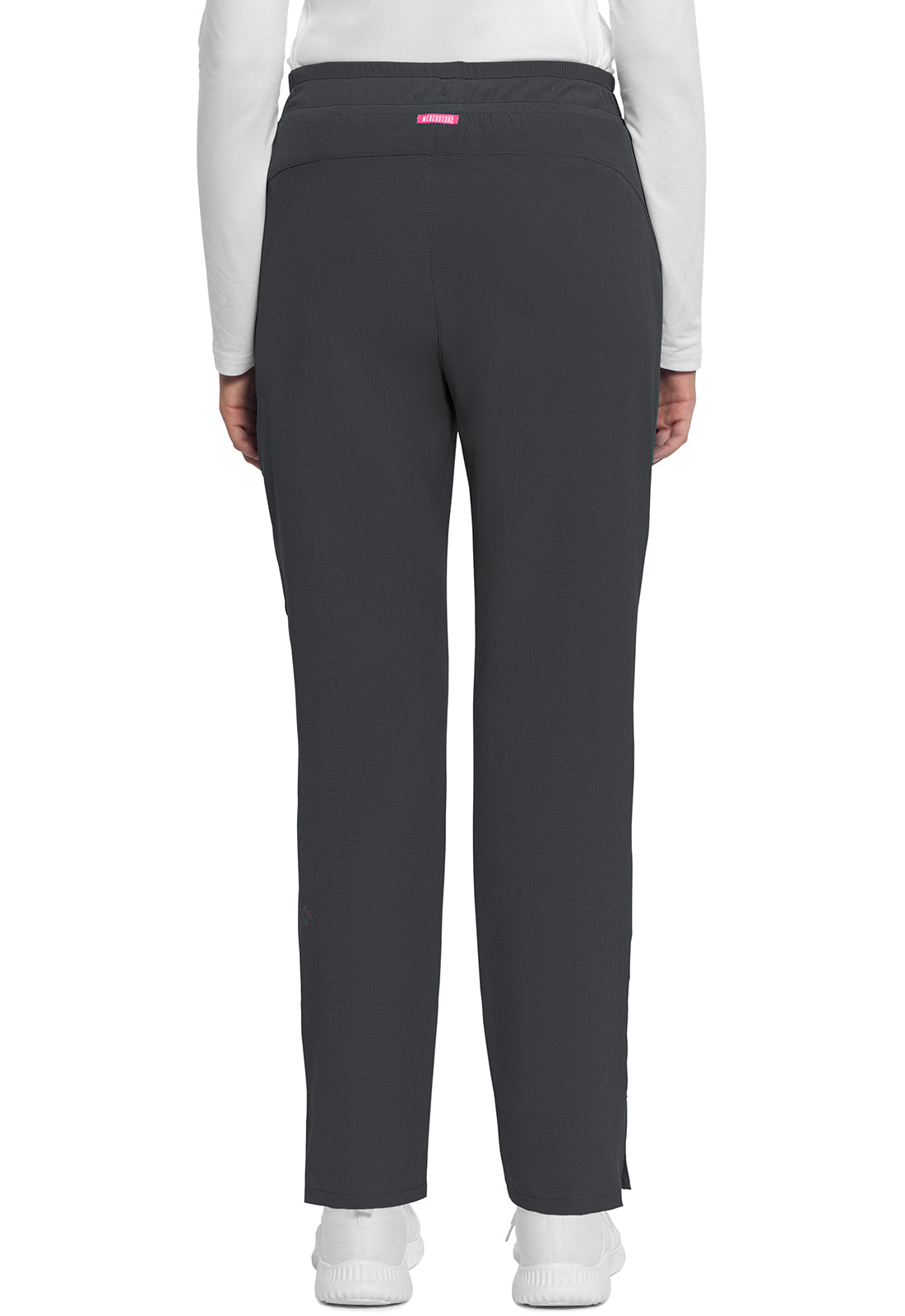 Med Couture mid-rise drawstring tapered leg scrub pants shown from the back, featuring a relaxed fit and functional pockets.