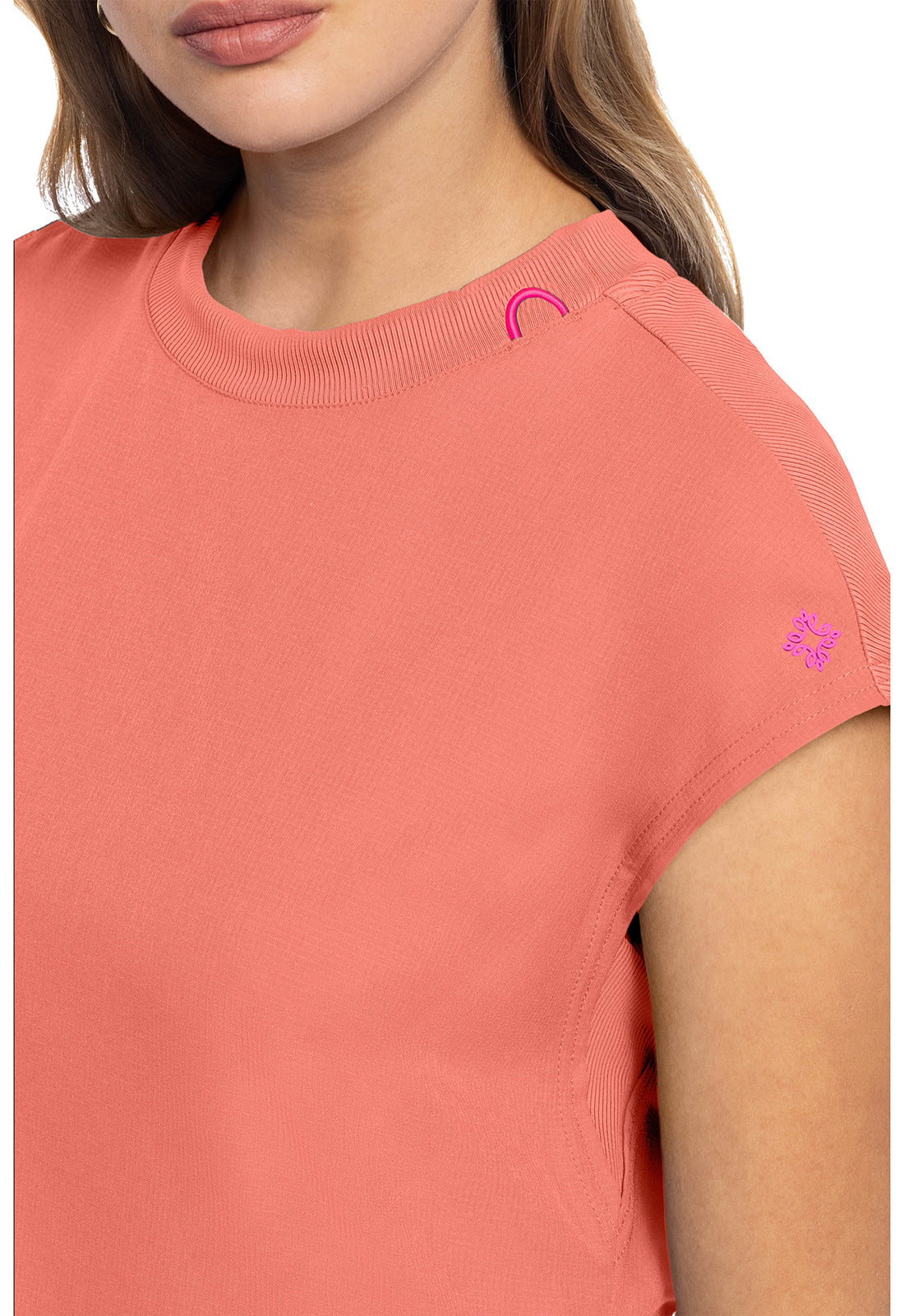 MEDCOUTURE round neck tuckable top in a soft fabric, featuring a sleek fit and classic design, shown on a model.